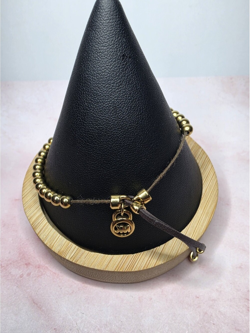 Michael Kors Gold Tone Beaded Leather Macrame Charm Slider Bracelet